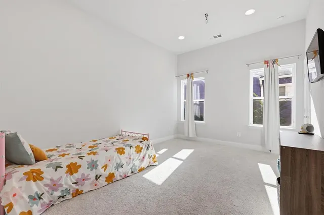 a bedroom with a bed and a cabinets