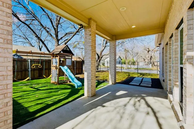 a view of swimming pool with a patio