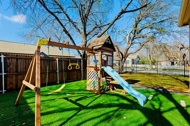 a front view of a house with swimming pool and porch