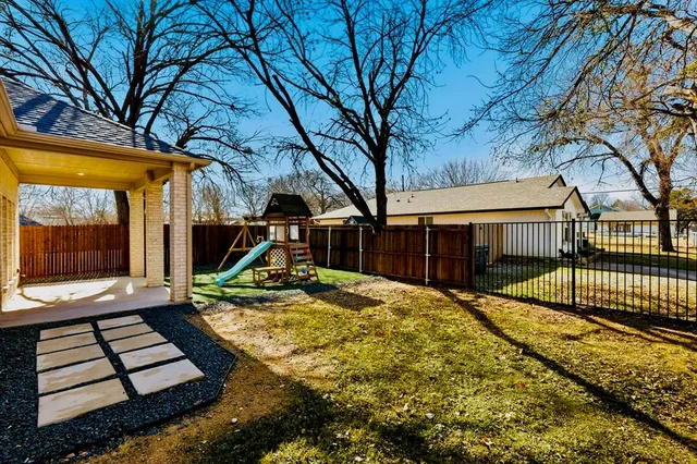 a view of house with backyard porch and sitting area