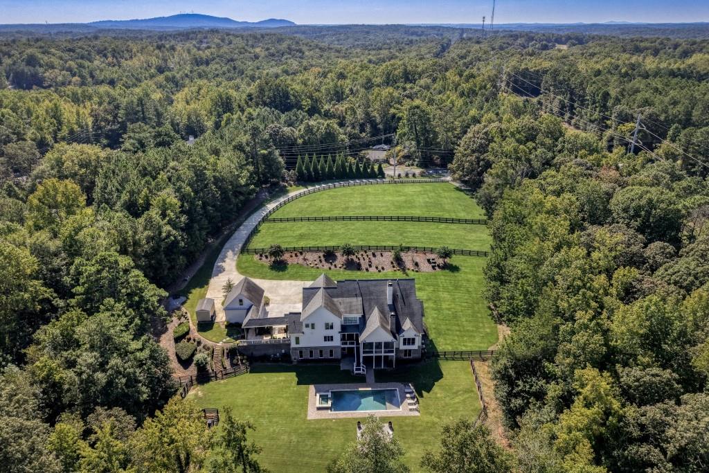 13235 Arnold Mill Road Roswell, GA 30075 - Photo 1 of 72 an aerial view of a house with a yard