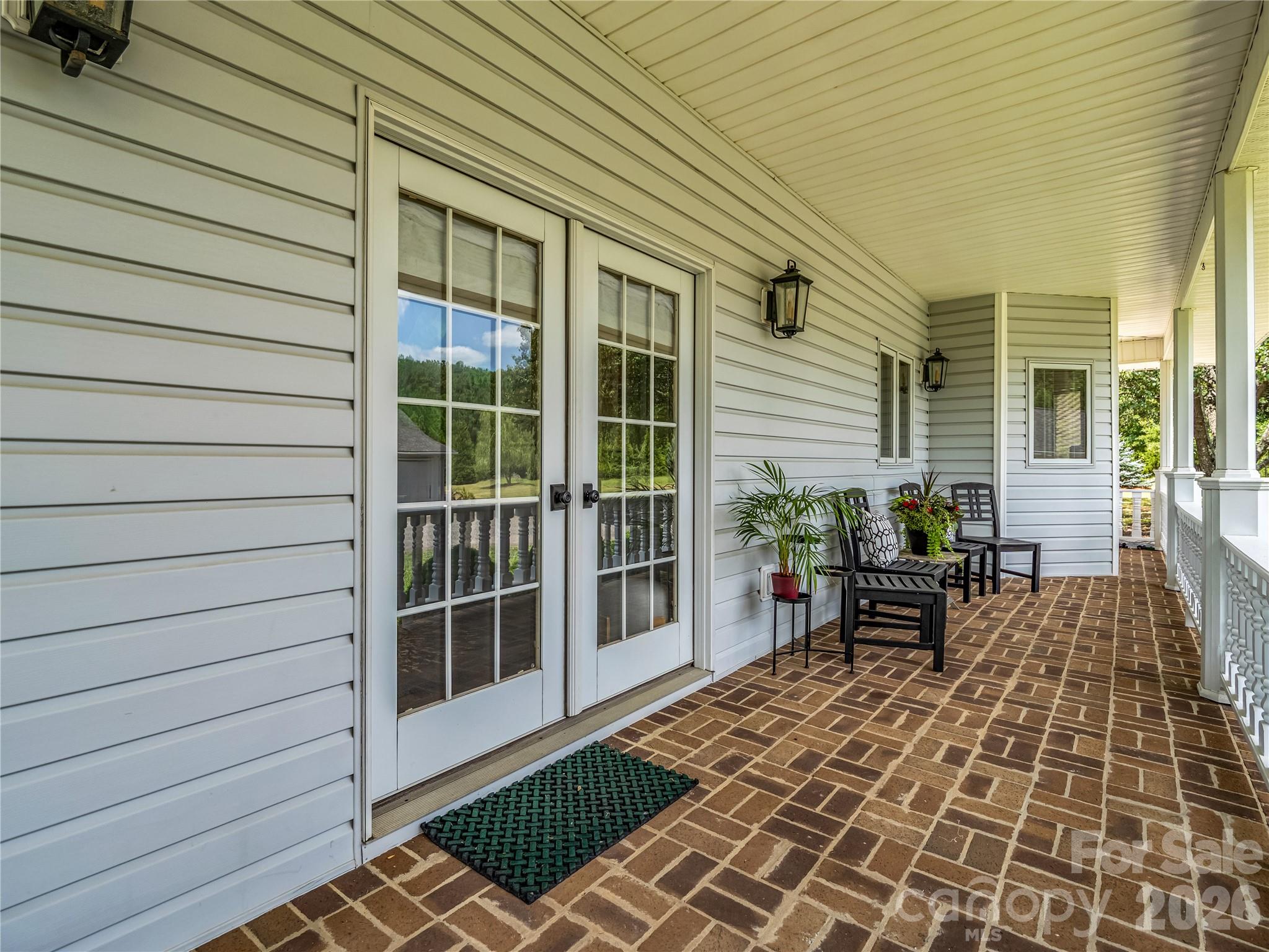 885 Salem Church Road Bostic, NC 28018 - Photo 10 of 30 a view of a patio with table and chairs with wooden floor and fence