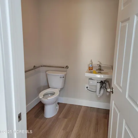 a bathroom with a toilet and a sink