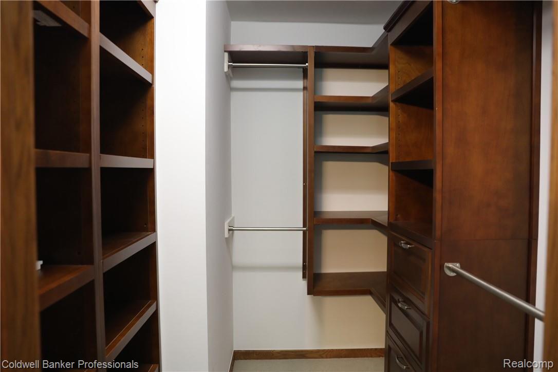 9840 Norman Road Clarkston, MI 48348 - Photo 22 of 45 Custom master walk-in closet.