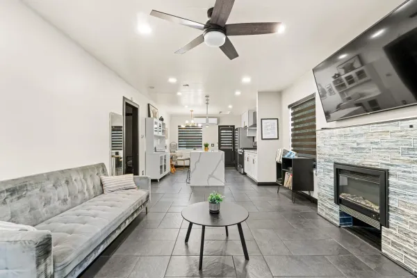 a living room with furniture and a fireplace