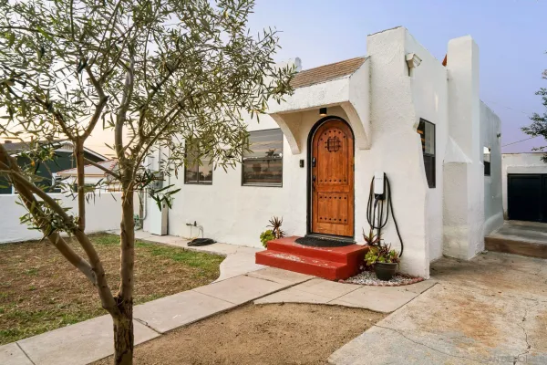 a front view of a house with garden