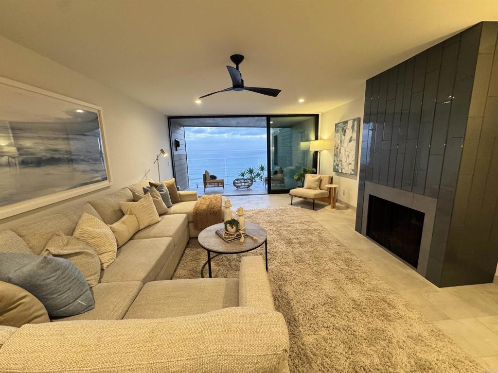375 West I Street Encinitas, CA 92024 - Photo 14 of 65 a living room with furniture and a fireplace