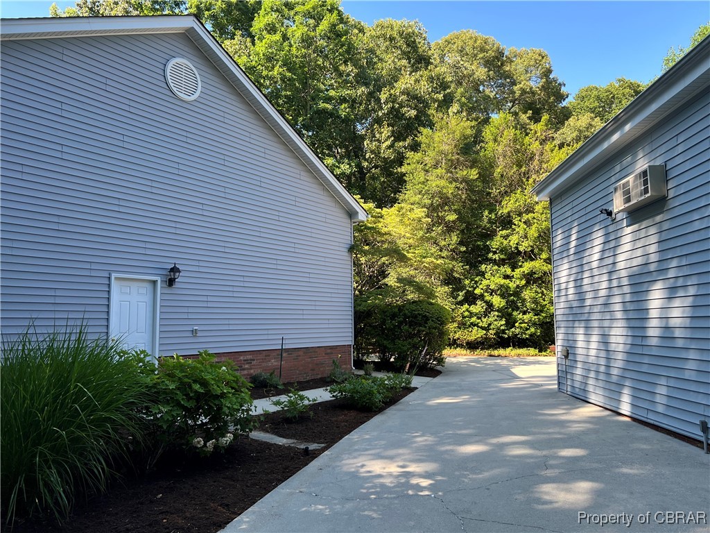 404 Wading Creek Road Dutton, VA 23050 - Photo 49 of 49 Concrete Drive and Walk way between 2 Car Garage attached with Finished Living Space above and RV 40 x 42 Garage Rear Entrance