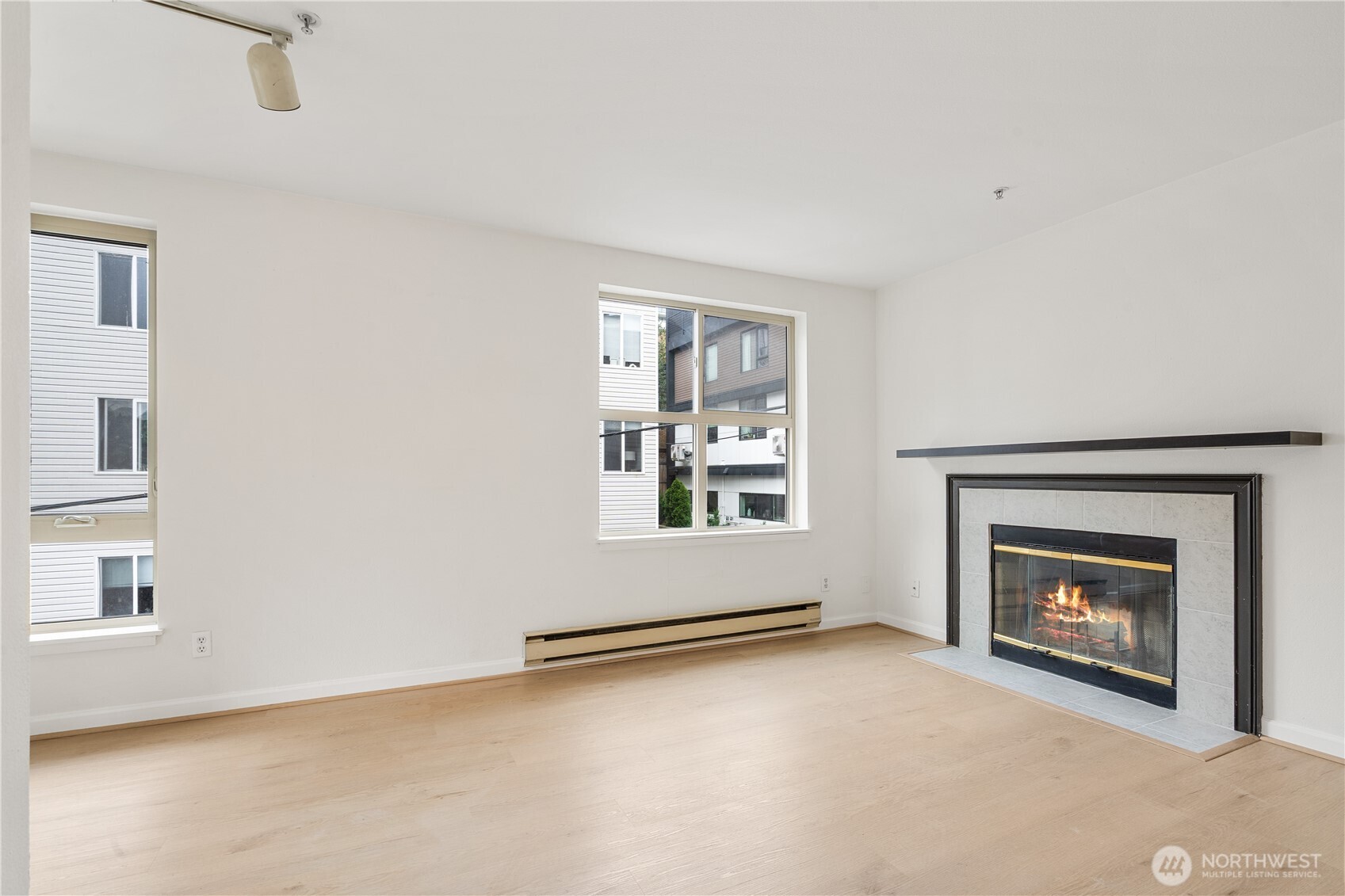 769 Hayes Street, Unit 405 Seattle, WA 98109 - Photo 12 of 29 an empty room with windows