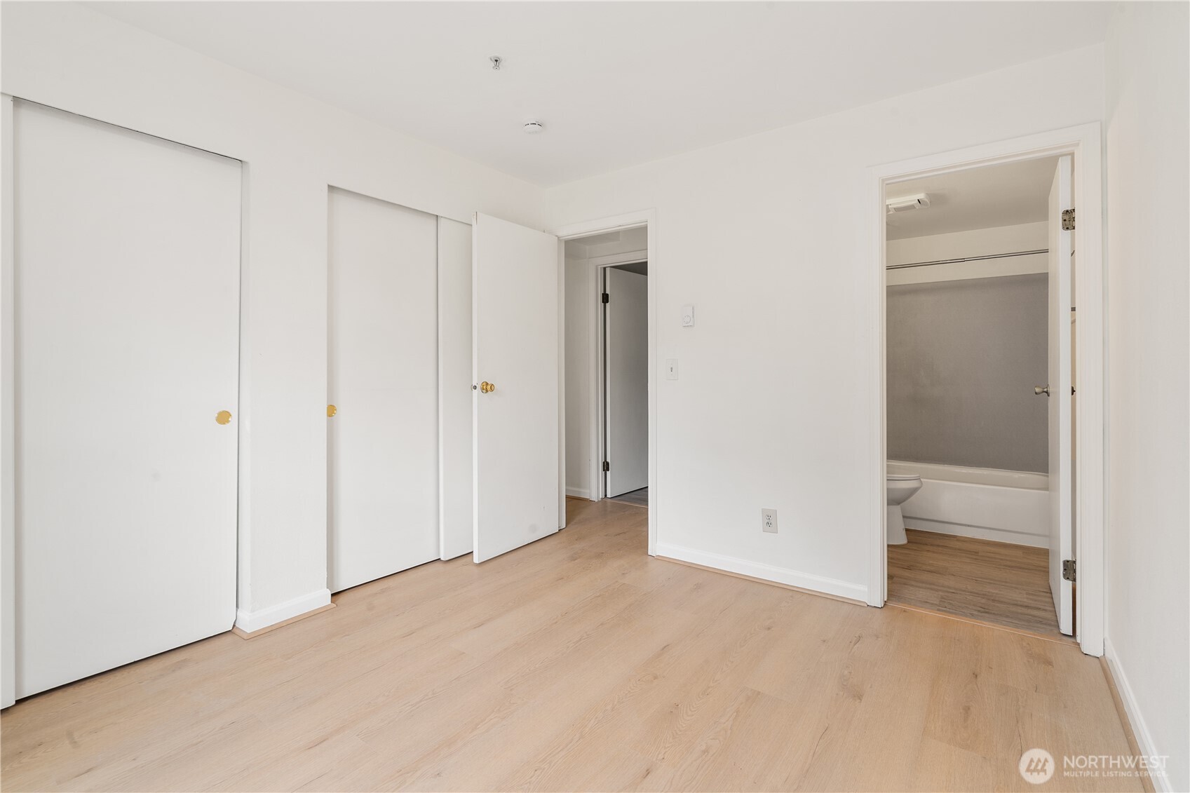 769 Hayes Street, Unit 405 Seattle, WA 98109 - Photo 14 of 29 an empty room with closet area