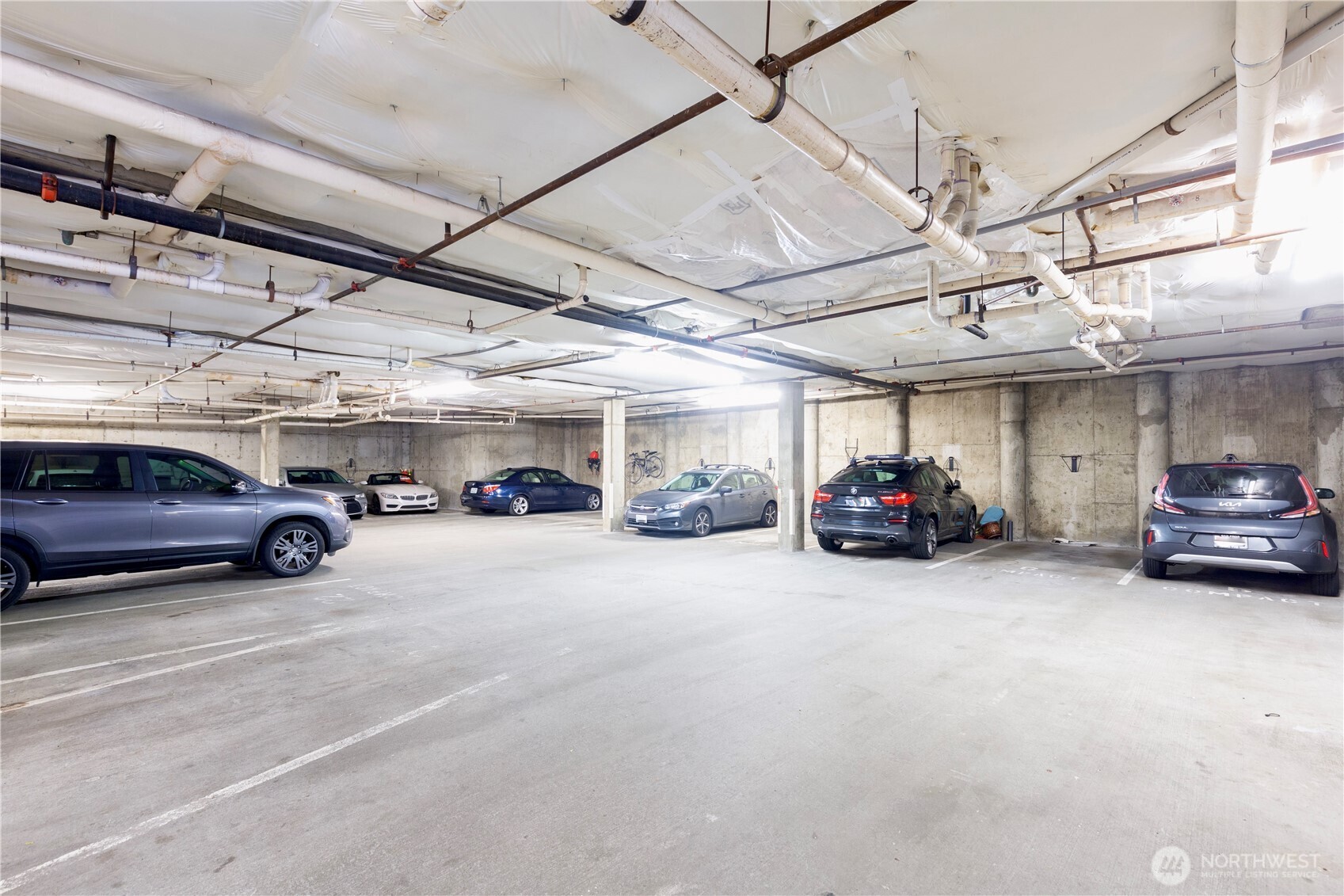 769 Hayes Street, Unit 405 Seattle, WA 98109 - Photo 28 of 29 a view of parking garage with cars