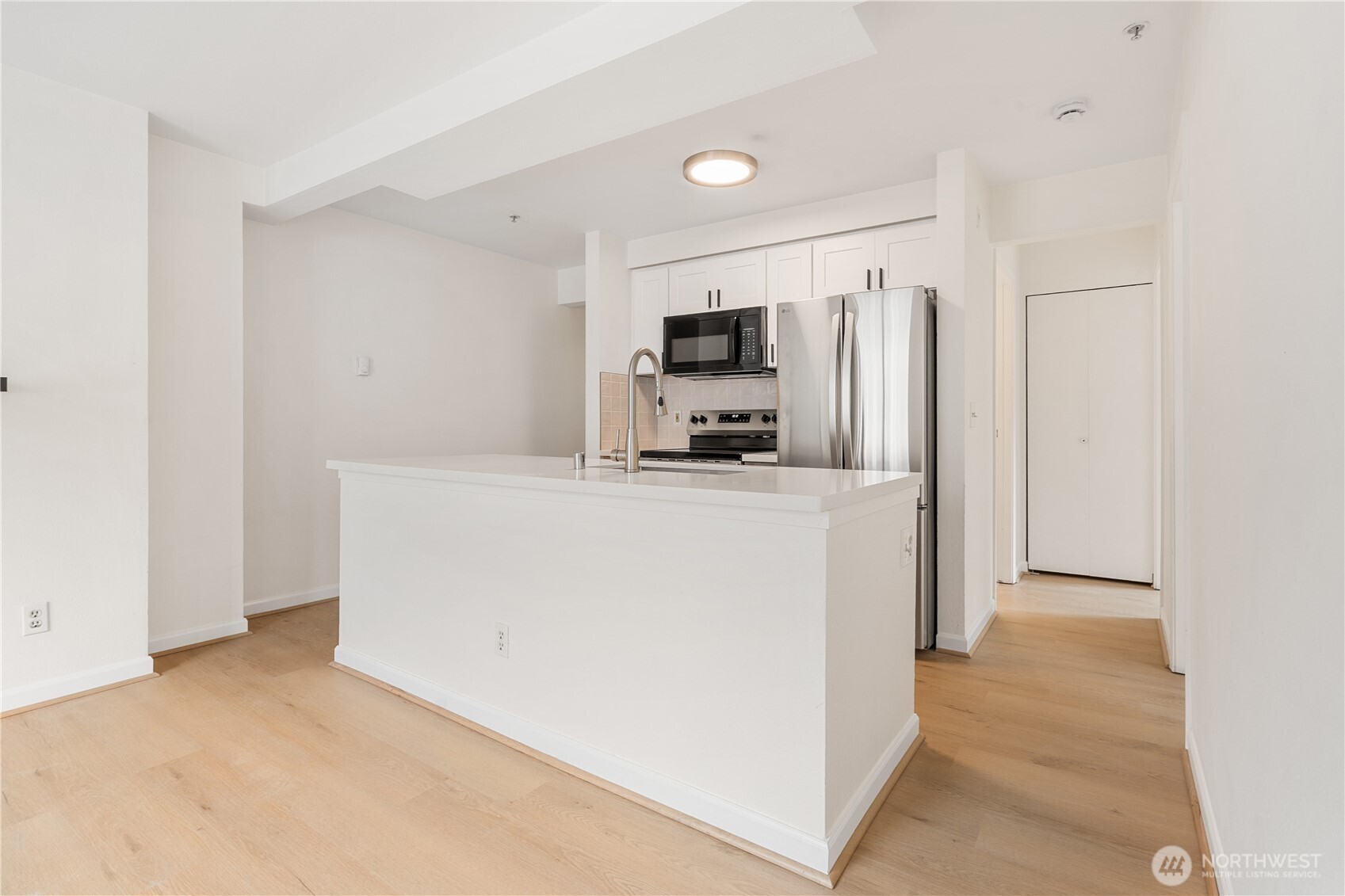 769 Hayes Street, Unit 405 Seattle, WA 98109 - Photo 9 of 29 a view of kitchen and refrigerator