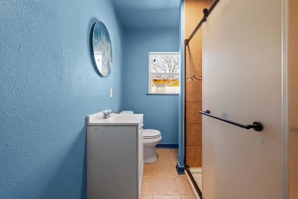 a bathroom with a toilet and a sink