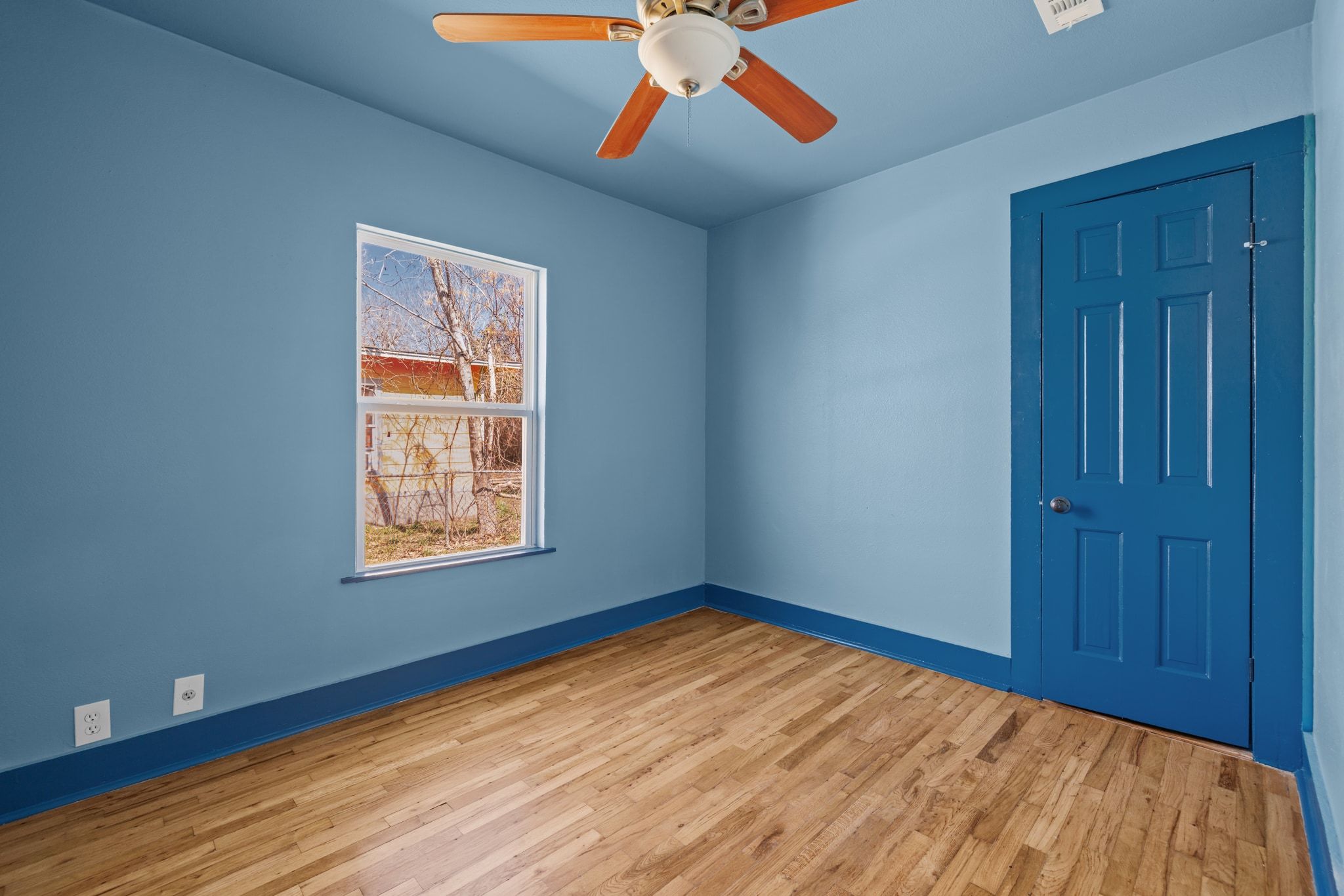 1181 Graham Street Austin, TX 78702 - Photo 17 of 27 a view of empty room with wooden floor and fan