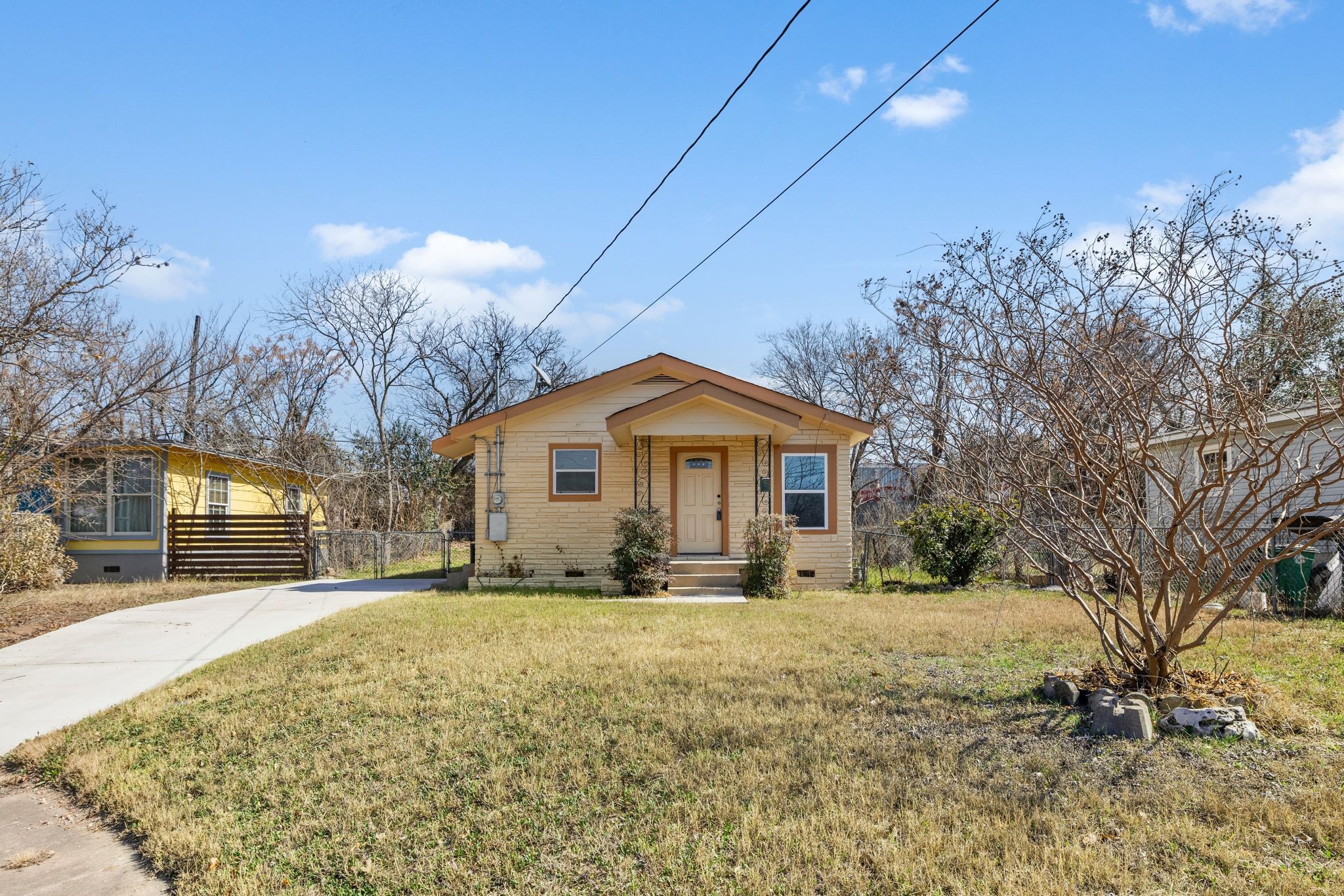 1181 Graham Street Austin, TX 78702 - Photo 3 of 27 a view of a house with a yard covered in snow