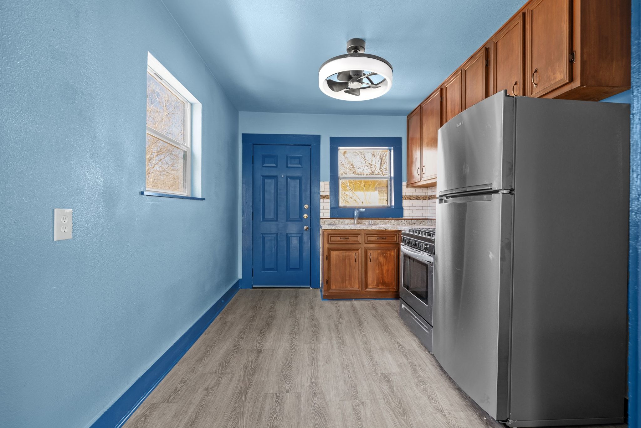 1181 Graham Street Austin, TX 78702 - Photo 8 of 27 a kitchen with a refrigerator and a stove