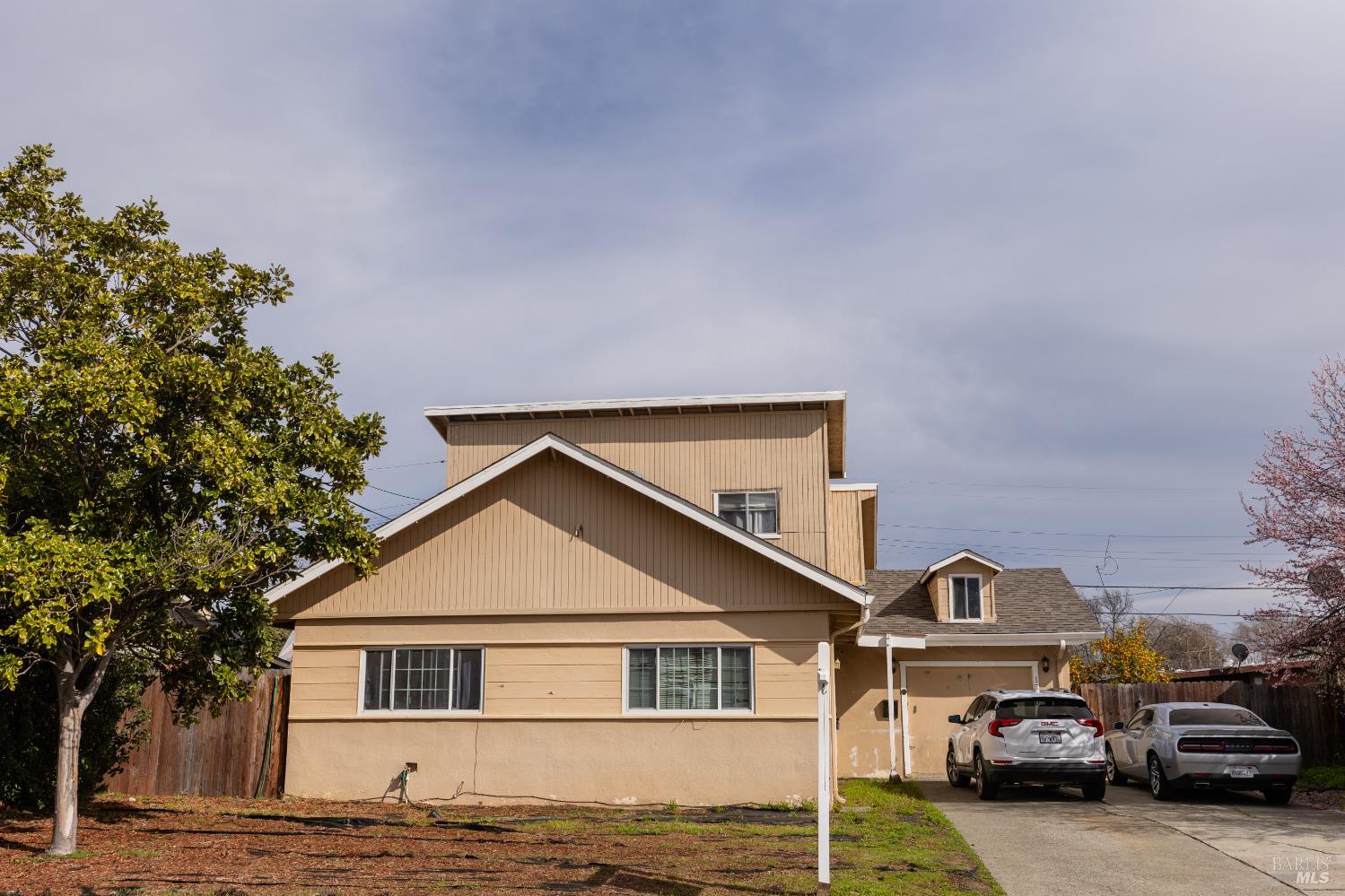 1500 Harrison Street Fairfield, CA 94533 - Photo 1 of 24 a front view of a house with a yard