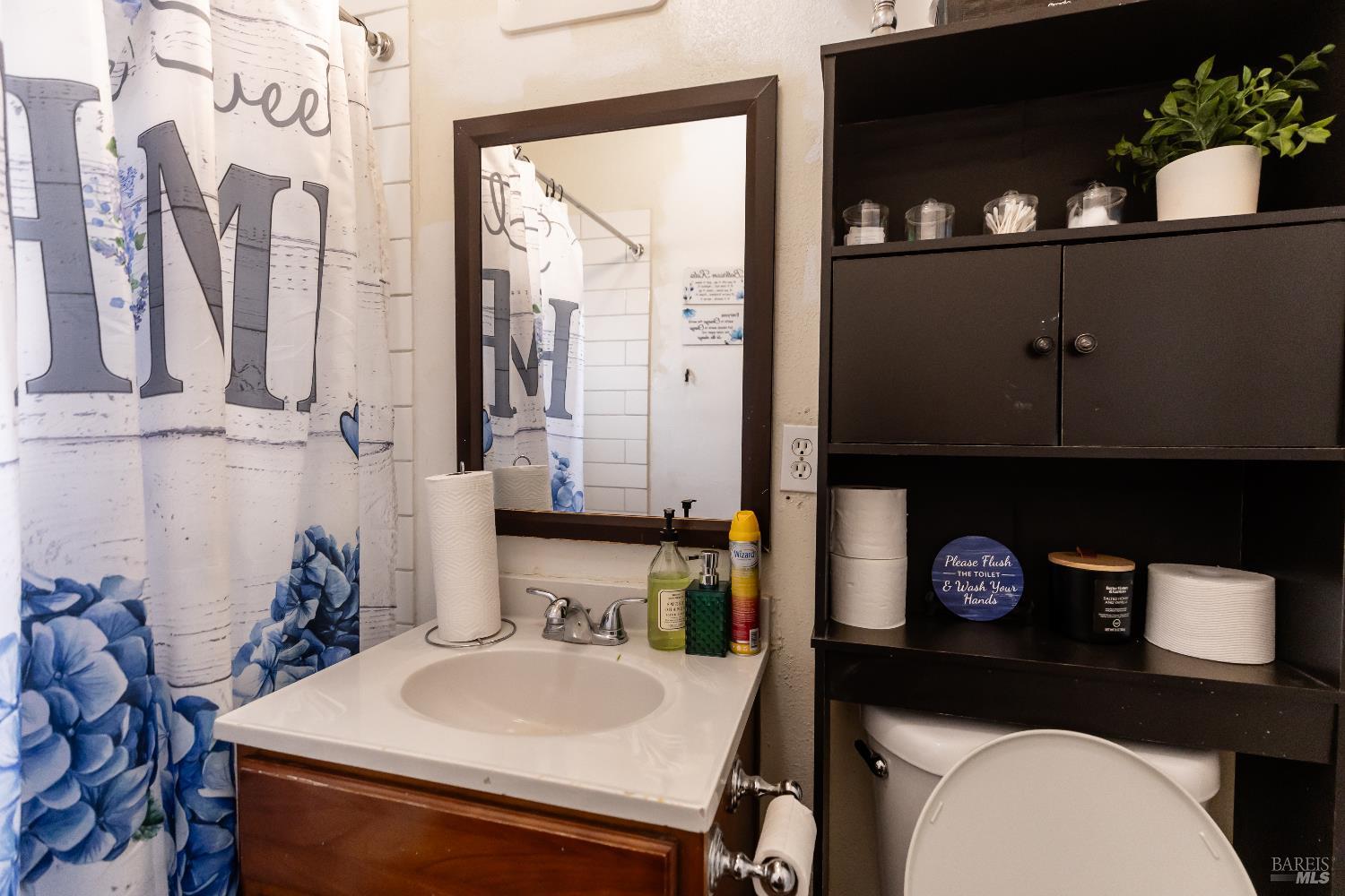 1500 Harrison Street Fairfield, CA 94533 - Photo 16 of 24 a bathroom with a sink a toilet and mirror