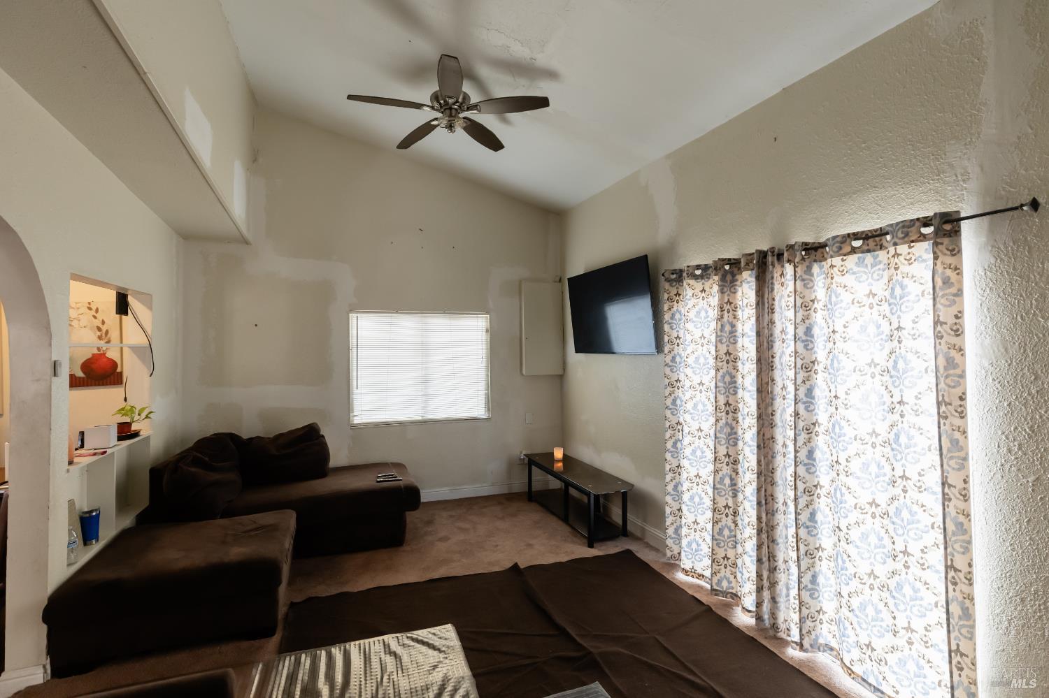 1500 Harrison Street Fairfield, CA 94533 - Photo 17 of 24 a living room with furniture and a flat screen tv