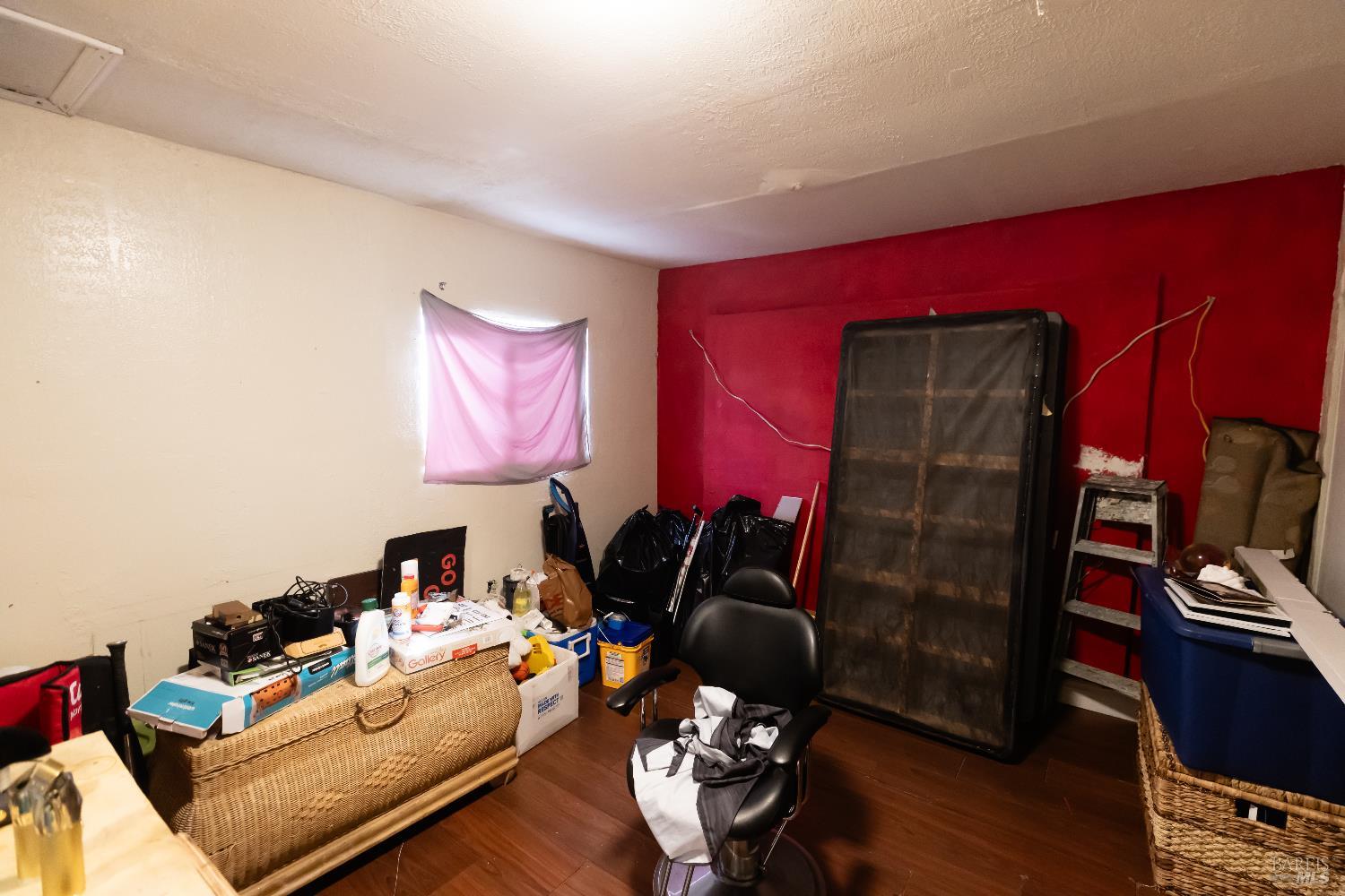 1500 Harrison Street Fairfield, CA 94533 - Photo 8 of 24 a living room with furniture a flat screen tv and a lamp