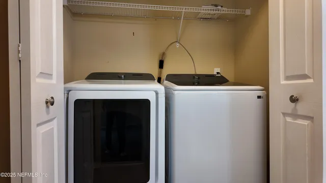 a utility room with dryer and washer