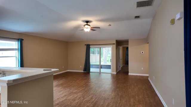 a view of an empty room with a window