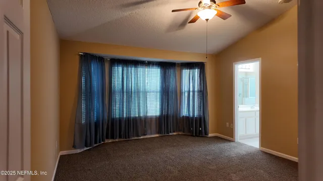 an empty room with closet area