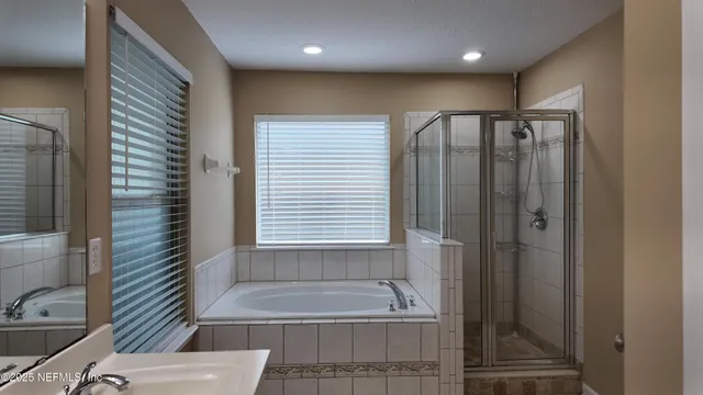a bathroom with a shower and a sink