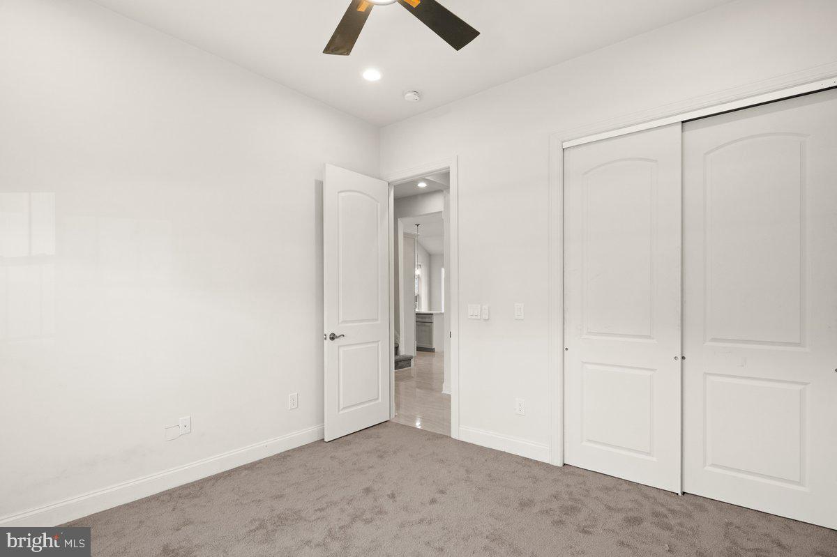 4 Samarpan Court Hightstown, NJ 08520 - Photo 18 of 39 an empty room with closet and a chandelier fan
