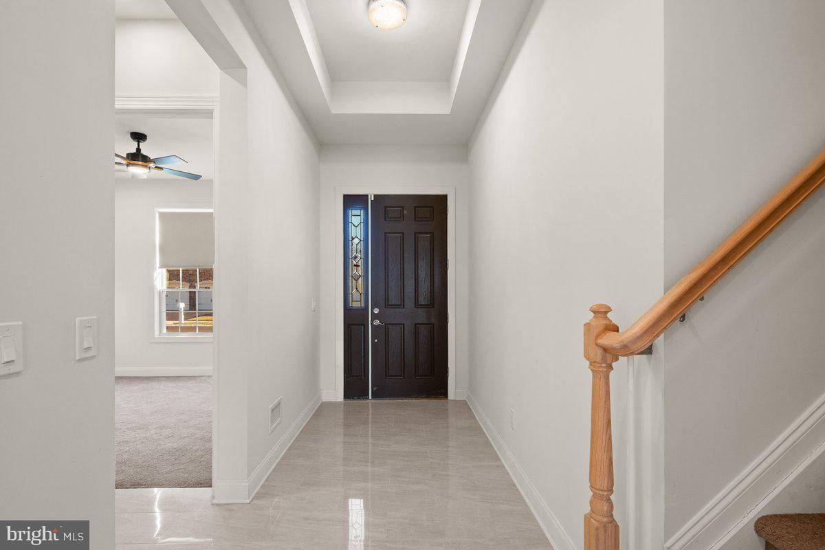 4 Samarpan Court Hightstown, NJ 08520 - Photo 19 of 39 a view of hallway with stairs and wooden floor