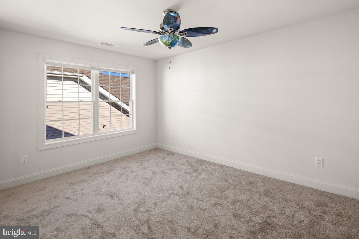 4 Samarpan Court Hightstown, NJ 08520 - Photo 24 of 39 an empty room with a window and a fan