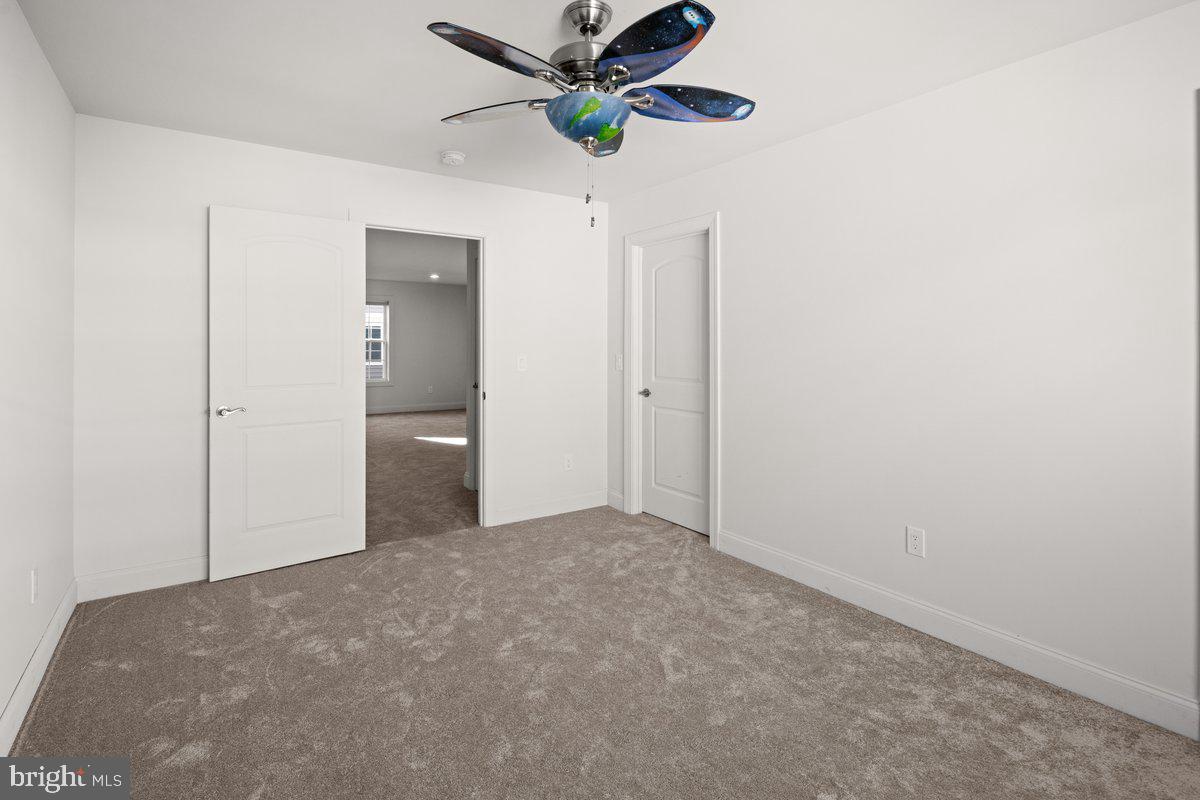4 Samarpan Court Hightstown, NJ 08520 - Photo 25 of 39 a view of a hallway with a chandelier fan