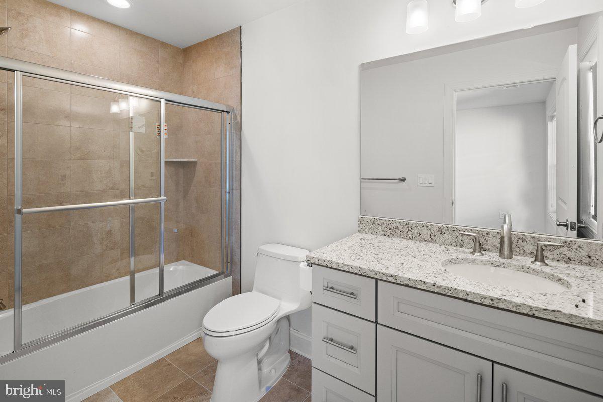 4 Samarpan Court Hightstown, NJ 08520 - Photo 27 of 39 a bathroom with a granite countertop sink toilet and shower