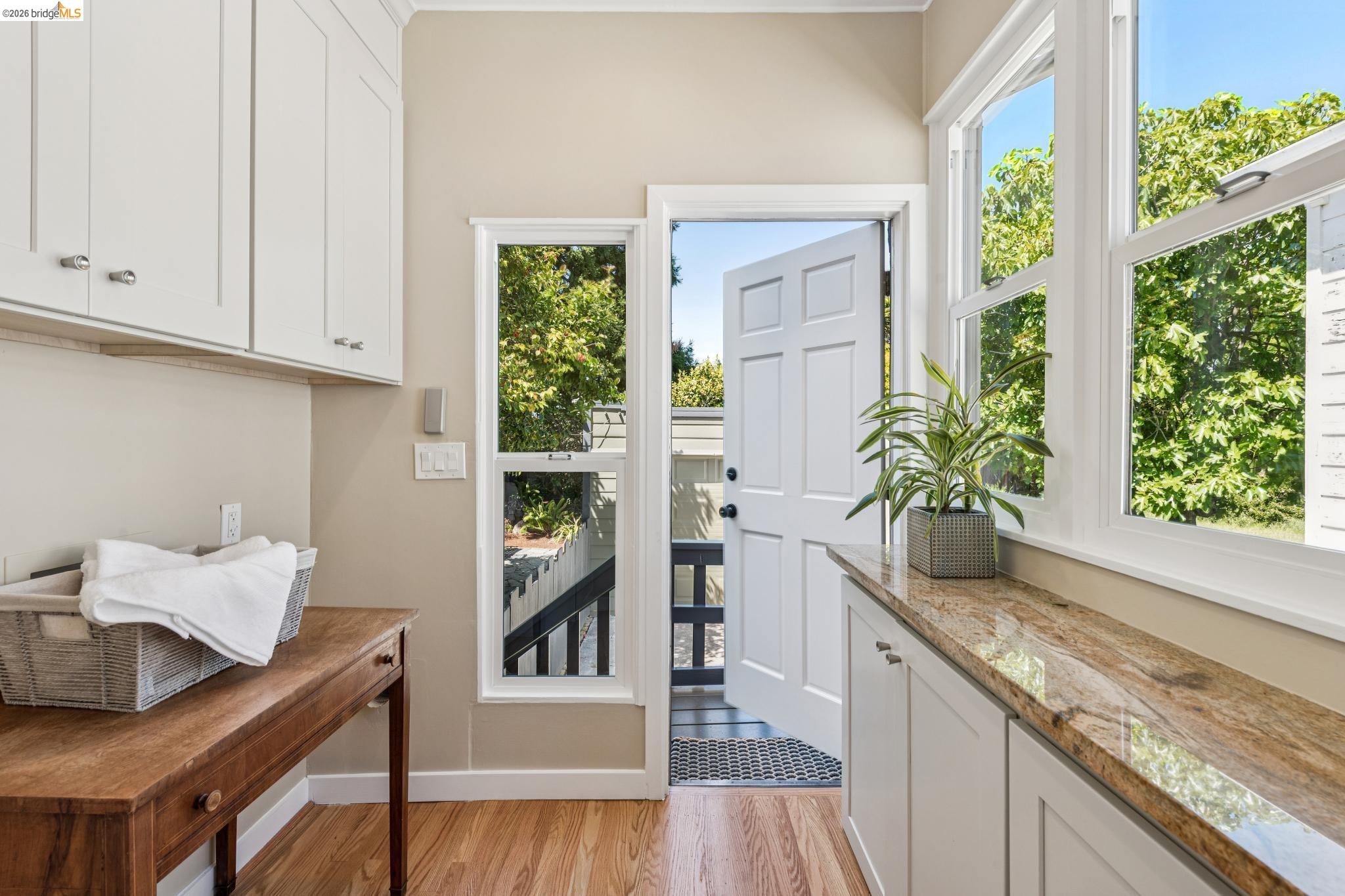 1233 Carleton Street Berkeley, CA 94702 - Photo 19 of 41 Dedicated laundry room with door to garage and back garden