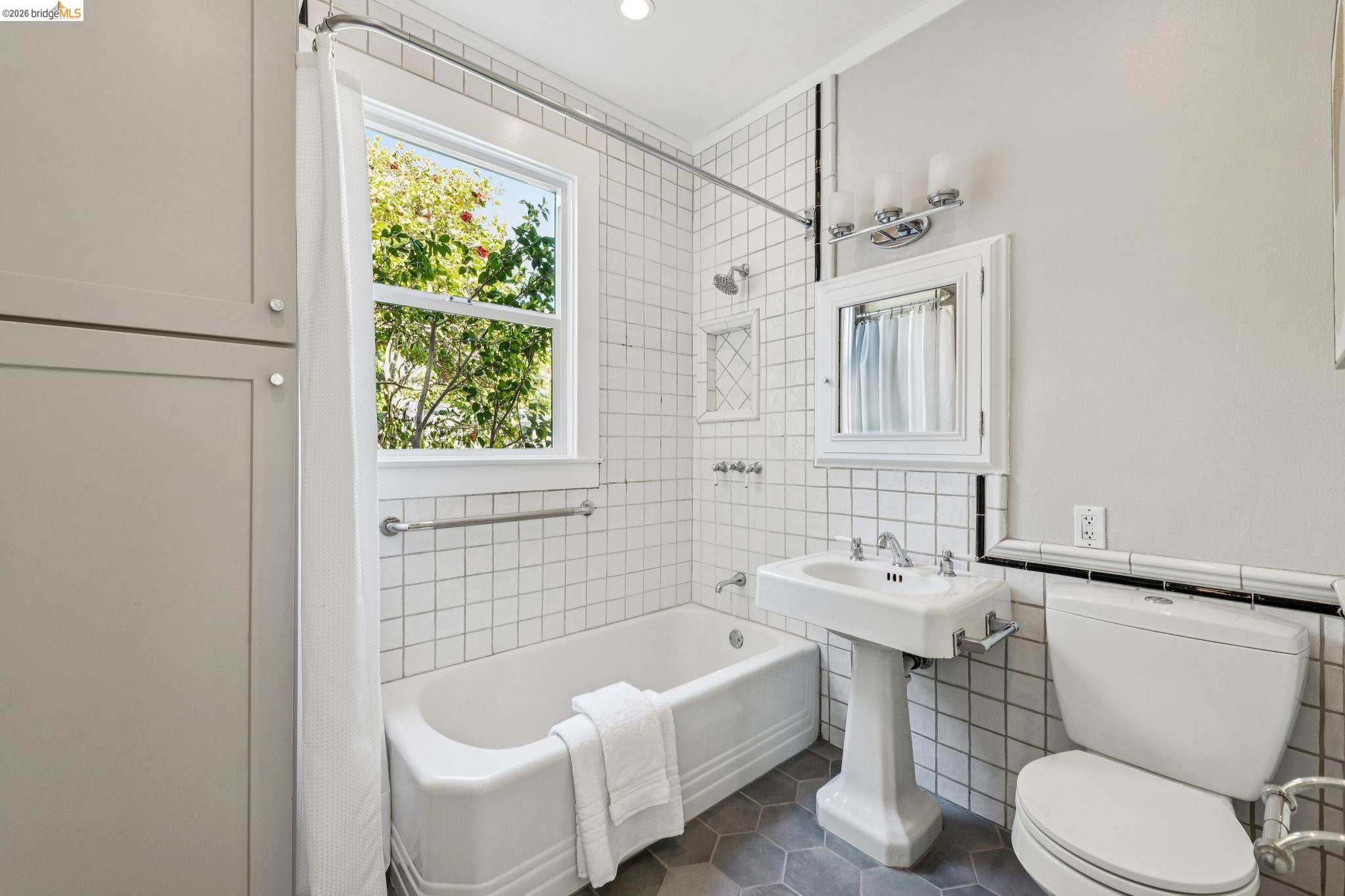 1233 Carleton Street Berkeley, CA 94702 - Photo 22 of 41 Full bath featuring with hex tile flooring, shower over tub