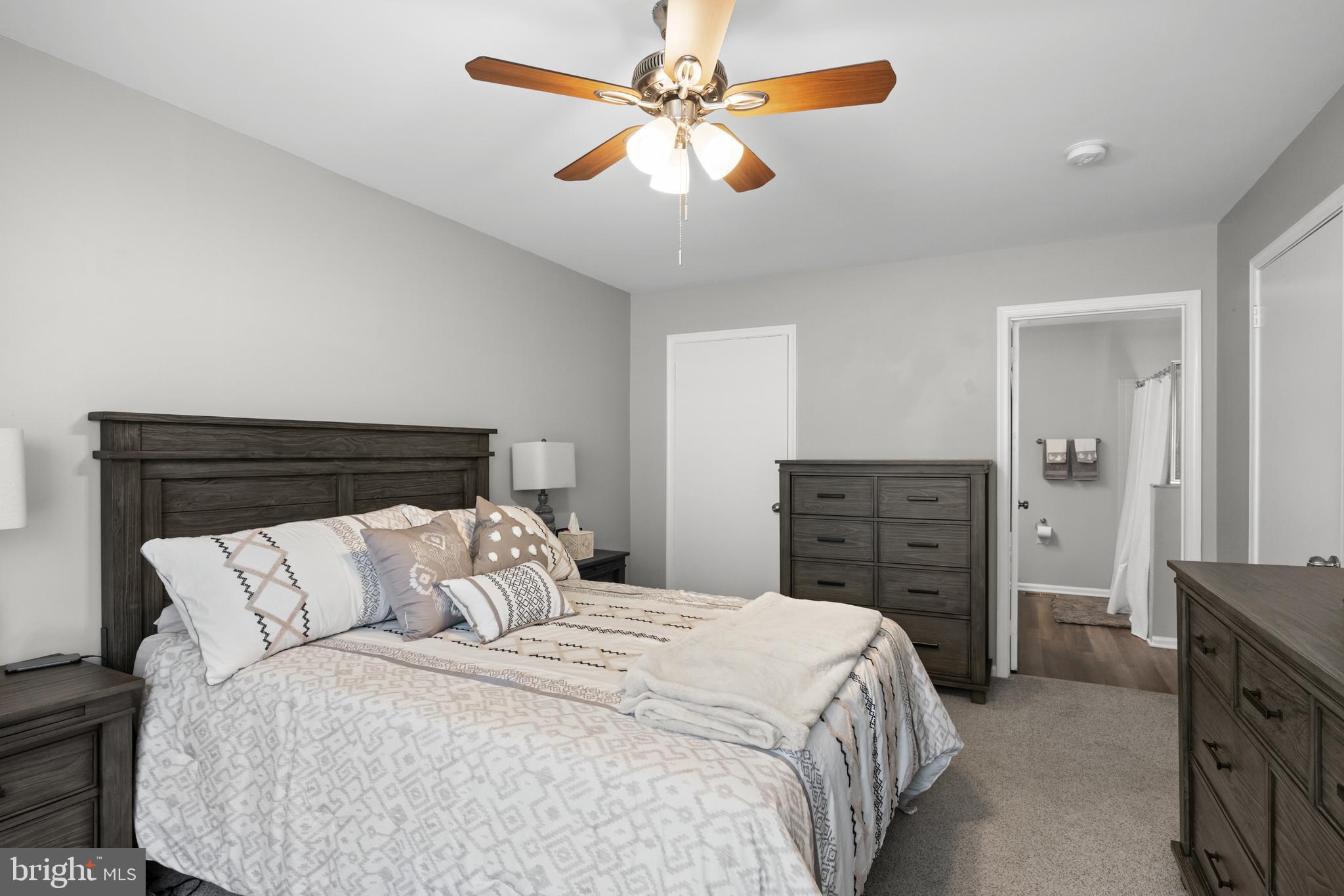 1401 Wharton Road Mount Laurel, NJ 08054 - Photo 14 of 31 a bedroom with a bed and a chandelier