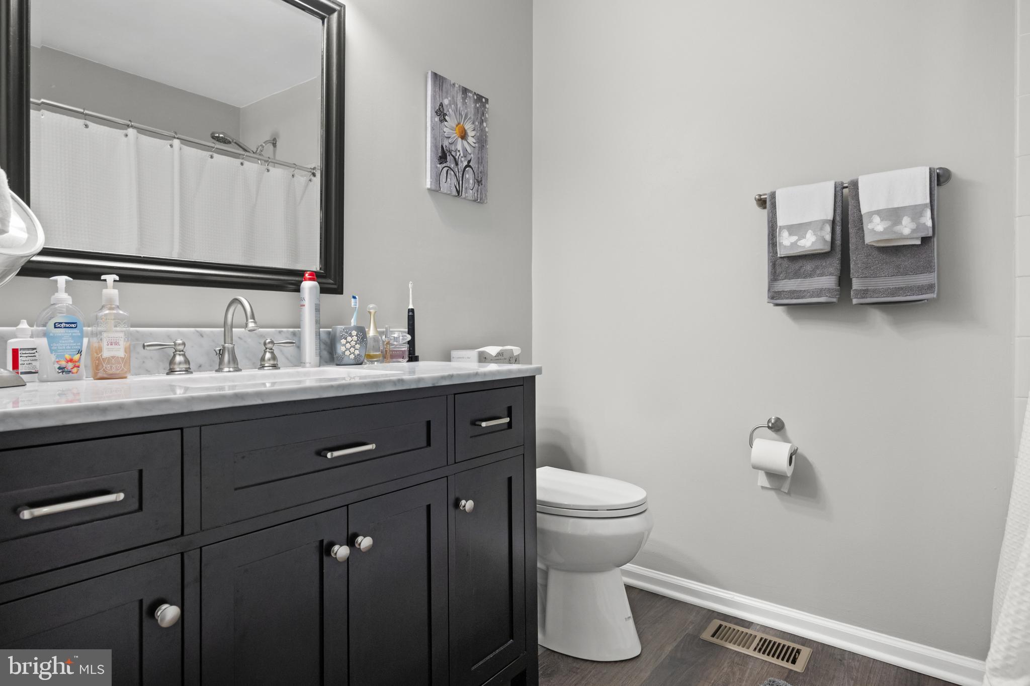 1401 Wharton Road Mount Laurel, NJ 08054 - Photo 15 of 31 a bathroom with a toilet sink and mirror
