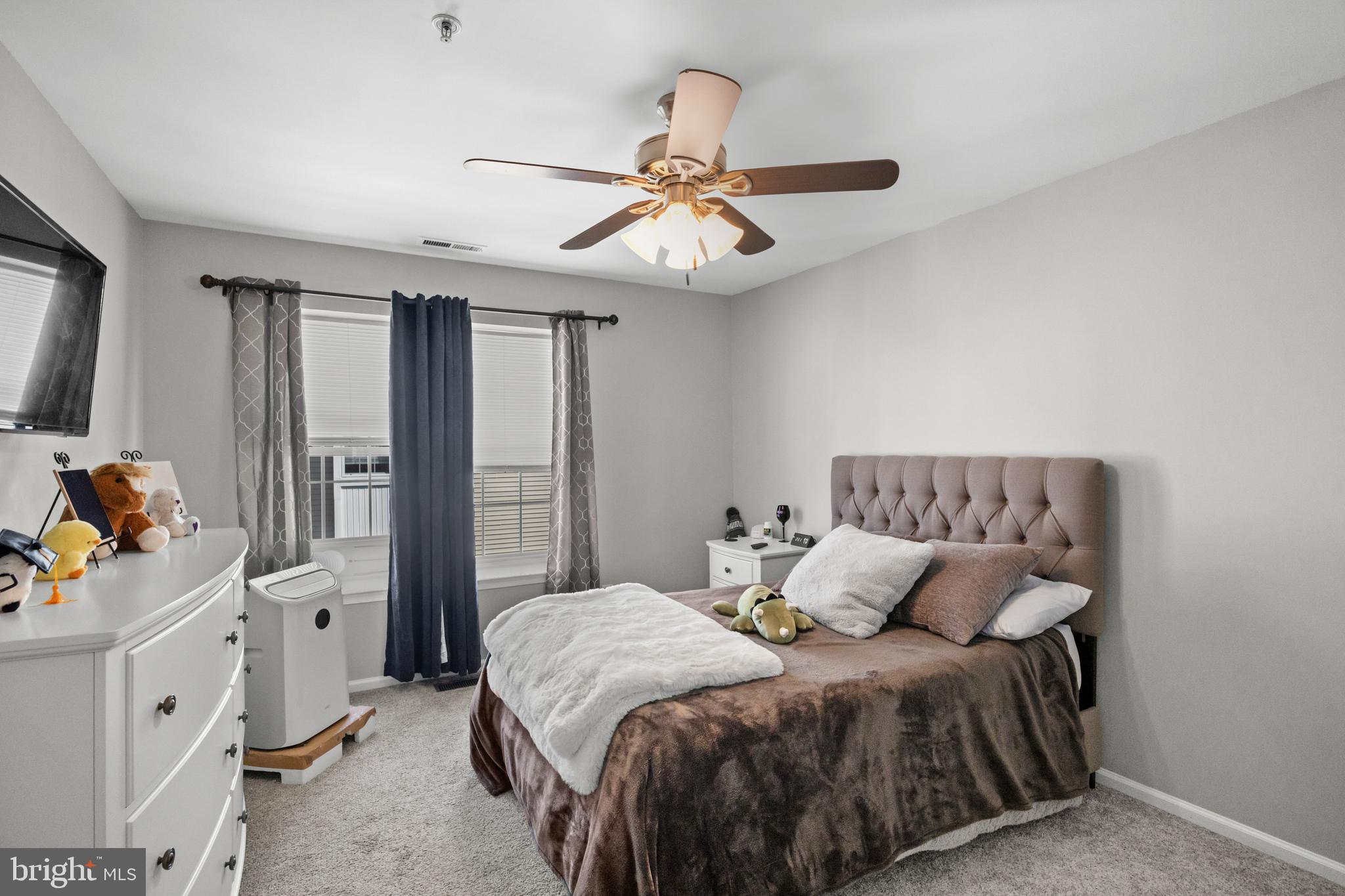 1401 Wharton Road Mount Laurel, NJ 08054 - Photo 19 of 31 a bedroom with a bed and a chandelier