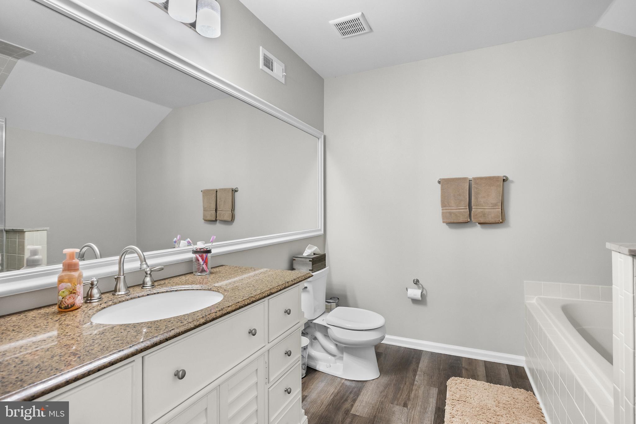 1401 Wharton Road Mount Laurel, NJ 08054 - Photo 21 of 31 a bathroom with a granite countertop sink and a mirror