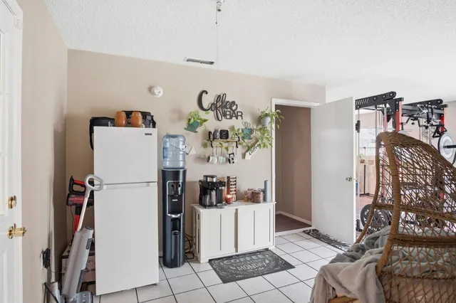 a view of a livingroom with furniture and a window