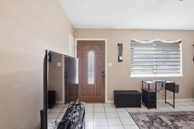 a view of a livingroom with furniture and windows