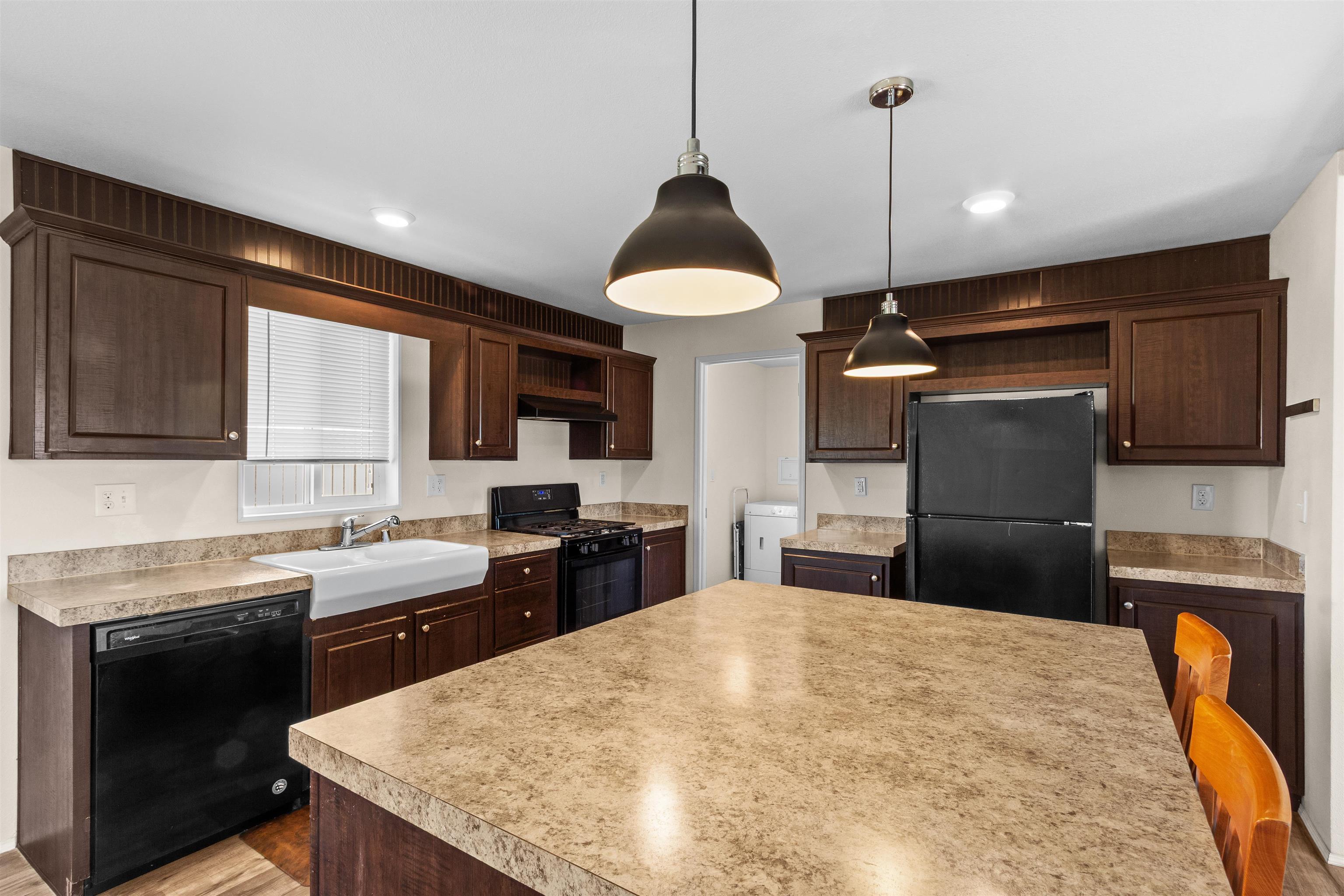 759 33 Road Clifton, CO 81520 - Photo 8 of 35 a kitchen with a sink a stove and refrigerator