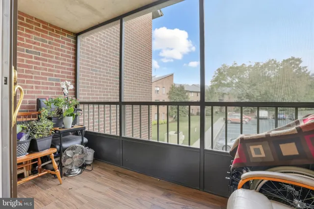 a living room filled with furniture and a potted plant