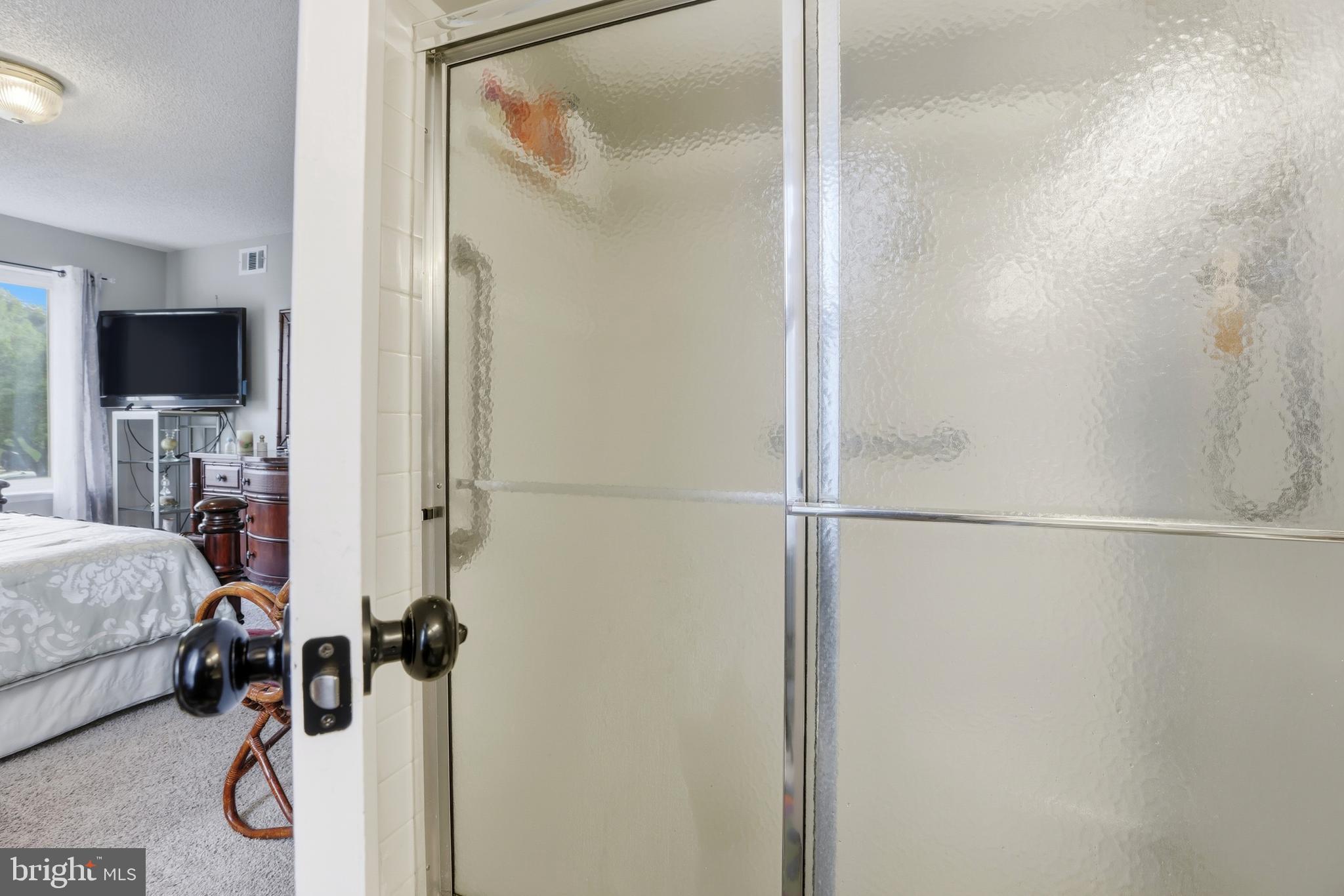 15300 Beaverbrook Court, Unit 882E Silver Spring, MD 20906 - Photo 22 of 30 a room with a walk in closet and a mirror