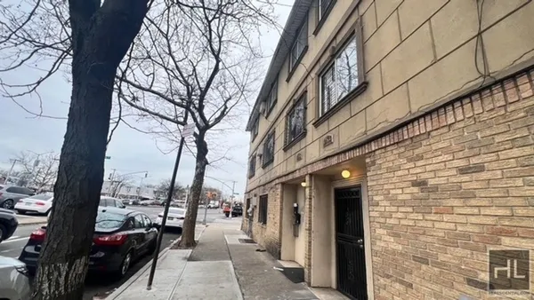 a view of a city street with cars