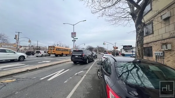 a view of a street with cars