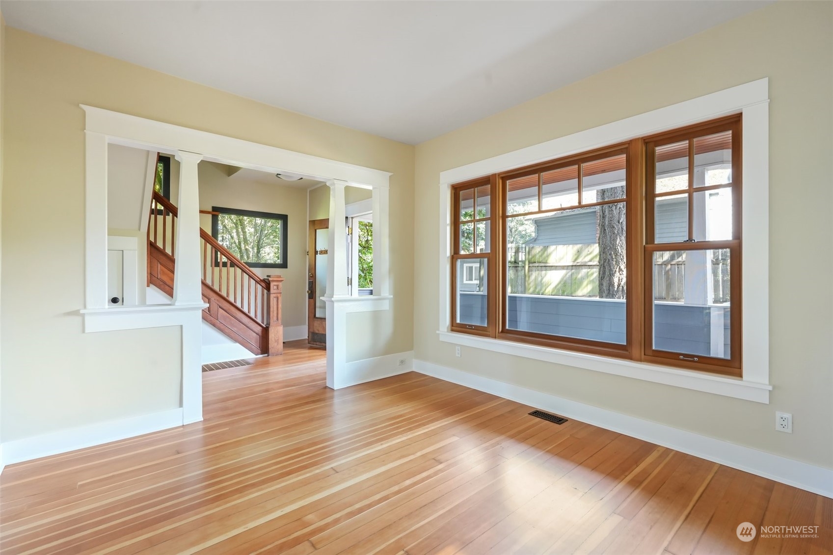 1702 North Pine Street Tacoma, WA 98406 - Photo 13 of 27 a view of an empty room with wooden floor and a window