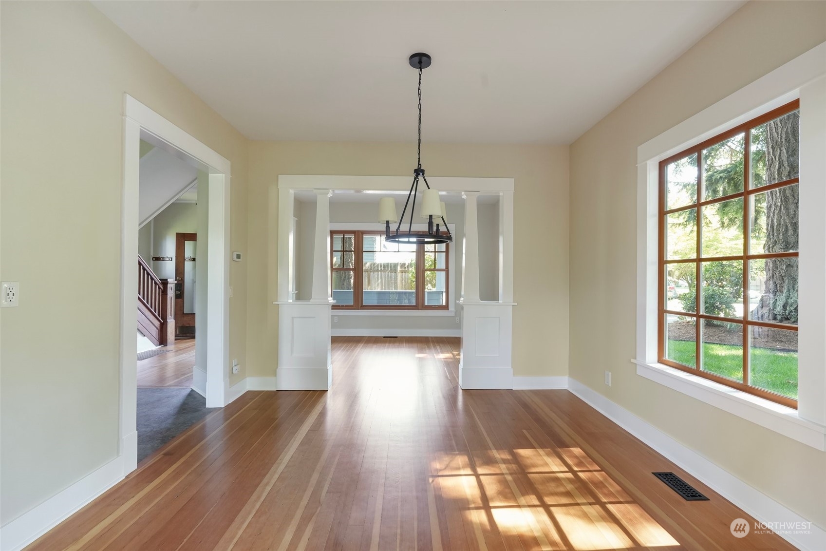 1702 North Pine Street Tacoma, WA 98406 - Photo 15 of 27 a view of a room with wooden floor staircase and a living room
