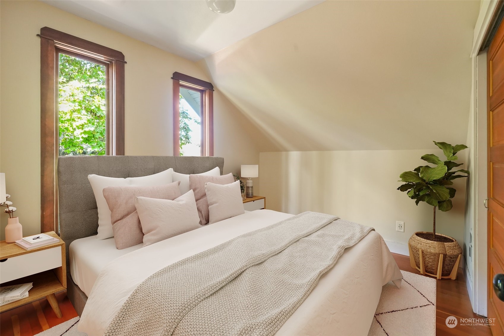 1702 North Pine Street Tacoma, WA 98406 - Photo 18 of 27 a bedroom with a bed and a potted plant