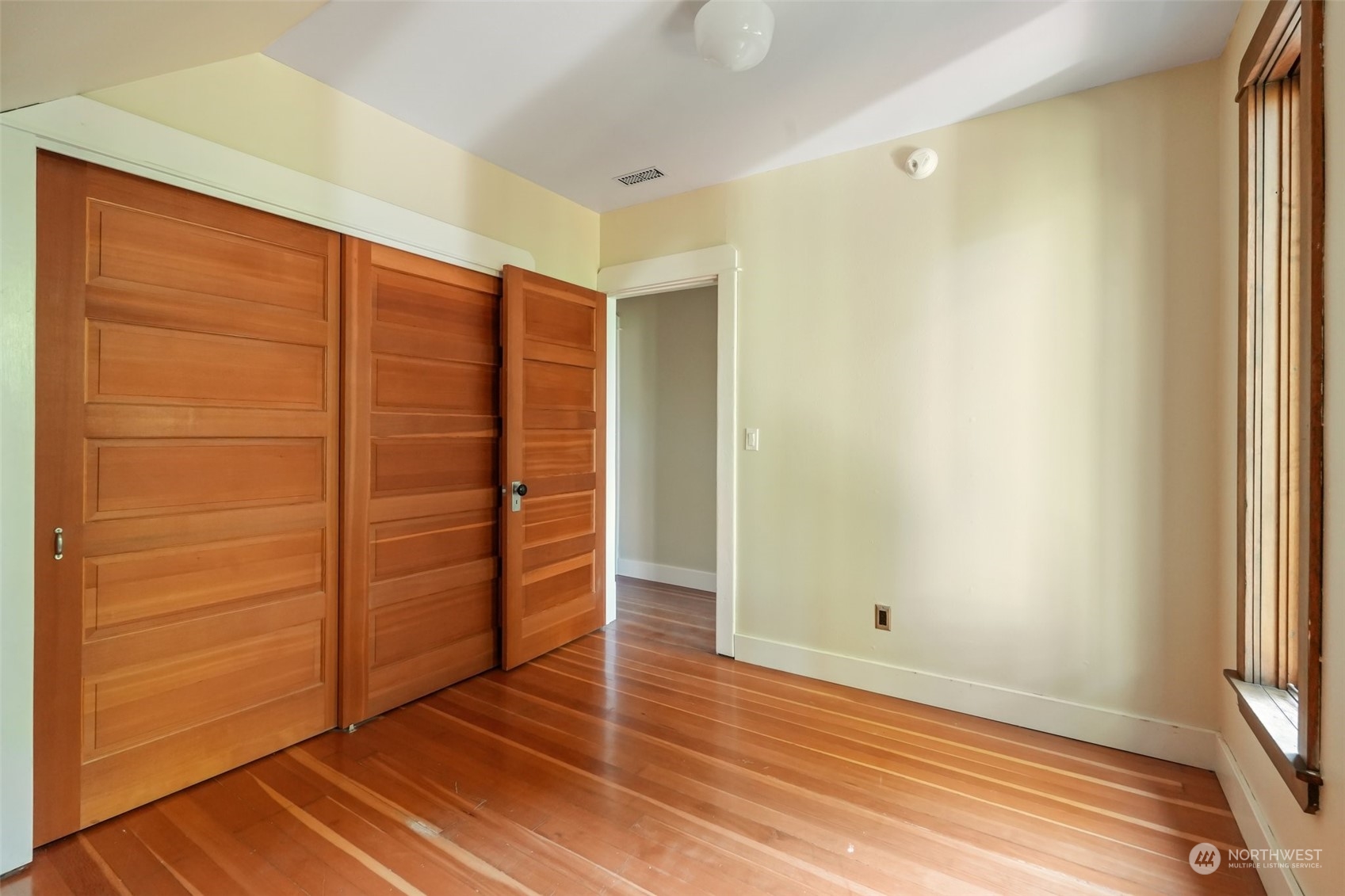 1702 North Pine Street Tacoma, WA 98406 - Photo 20 of 27 an empty room with wooden floor and cabinet